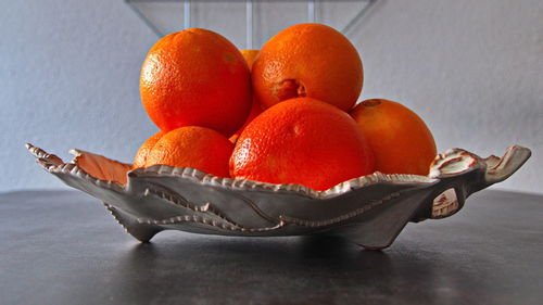 Close-up of orange fruits in bowl