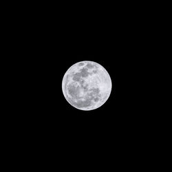 Low angle view of full moon in sky