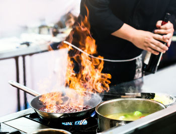 Midsection of man preparing food