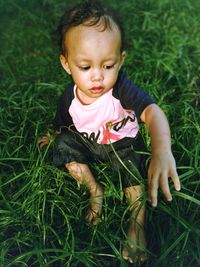 High angle view of cute baby on field