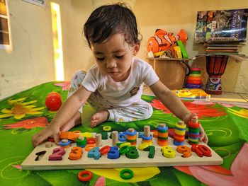 A child playing with his puzzle