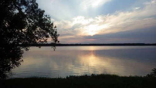 Scenic view of lake at sunset