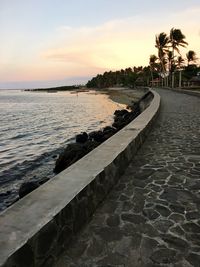 Scenic view of beach against sky during sunset