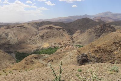 Scenic view of landscape and mountains against sky