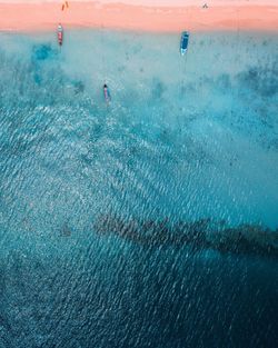 High angle view of people on sea shore