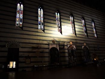 Low angle view of people in illuminated building