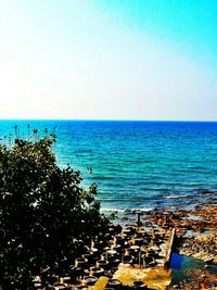 Scenic view of sea against blue sky