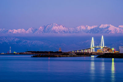 Toyama bay and tateyama mountain range - winter scenery at twilight