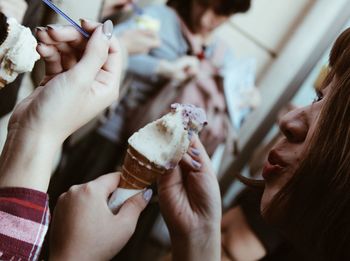 Midsection of woman holding ice cream