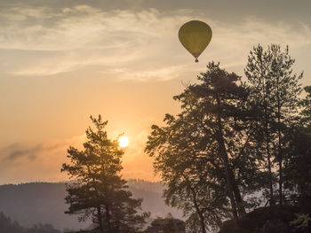 Low angle view of hot air balloon against sky during sunset