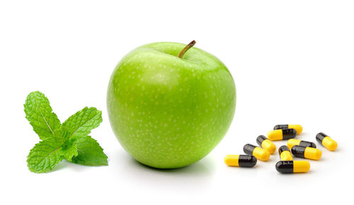 Close-up of apple against white background