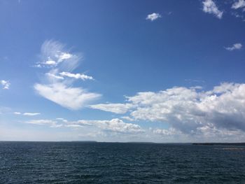 Scenic view of sea against blue sky