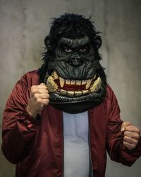 Portrait of man wearing gorilla mask