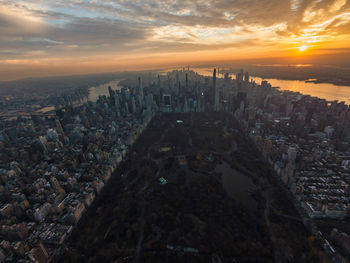 Aerial view of townscape against sky during sunset