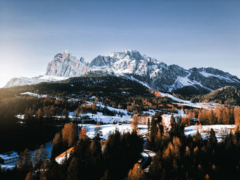 Scenic view of snowcapped mountains against clear sky