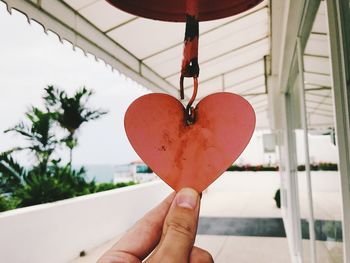 Close-up of hand holding strawberry