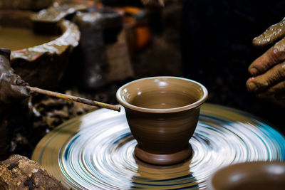 Close-up of person hand in bowl