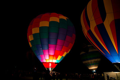 Illuminated hot air balloon against sky at night