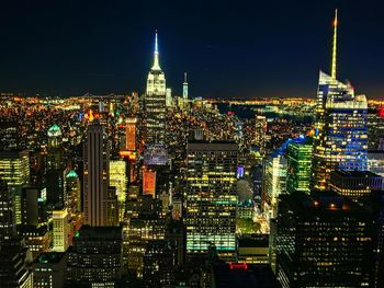 Illuminated buildings in city at night