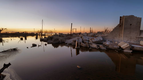 Scenic view of lake against sky during sunset