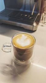 Close-up of coffee cup on table