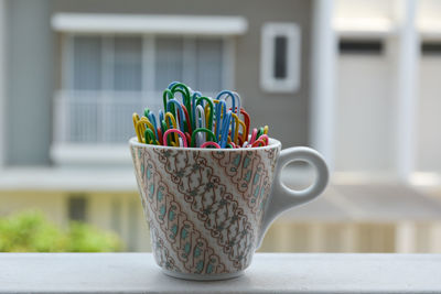 Close-up of multi colored candies in glass on table