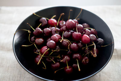 High angle view of strawberries in bowl on table