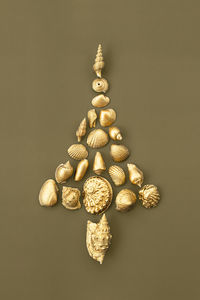 Christmas tree made from golden shells. christmas tree