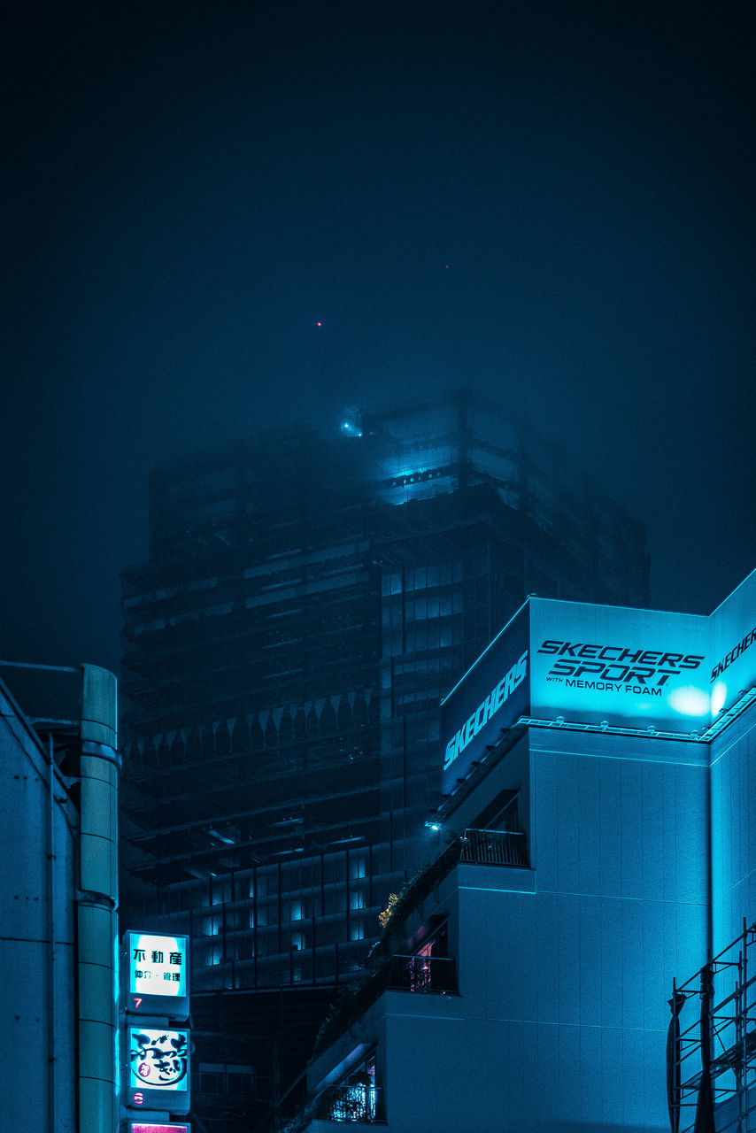 LOW ANGLE VIEW OF ILLUMINATED BUILDING AGAINST SKY