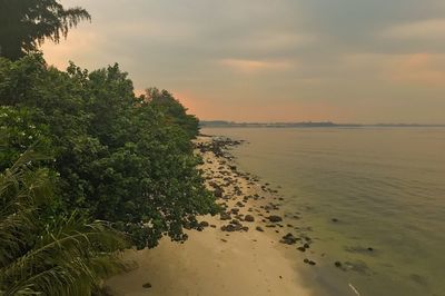 Scenic view of sea against sky at sunset