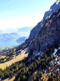 Scenic view of landscape and mountains against sky