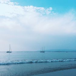 Scenic view of sea against cloudy sky