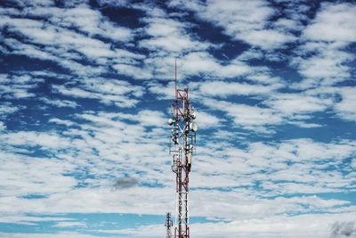 Low angle view of communications tower against sky