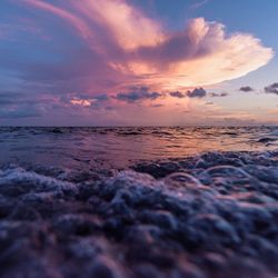 Scenic view of sea against dramatic sky