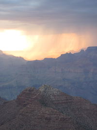 Scenic view of dramatic landscape during sunset