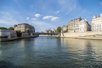 Beautiful buildings along the banks of the seine seen from the boat in paris