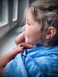 Close-up portrait of a girl at home