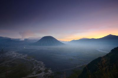 Scenic view of mountains against sky during sunset