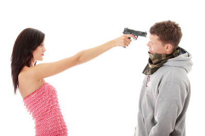 Friends standing against white background