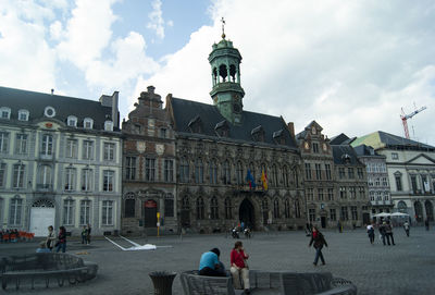 Group of people in front of historical building