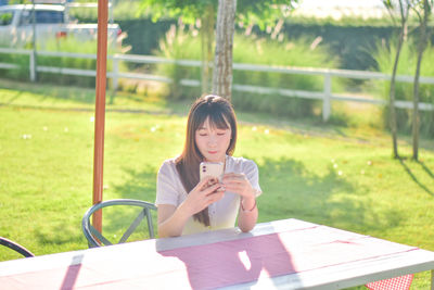 Young woman using mobile phone