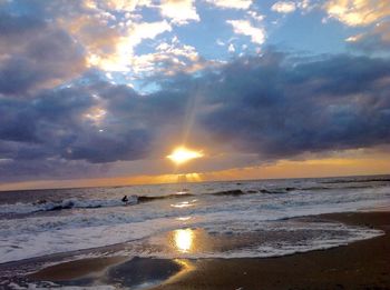 Scenic view of sea against cloudy sky