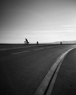 A father riding with his kids in a new built bicycle lane during french lockdown