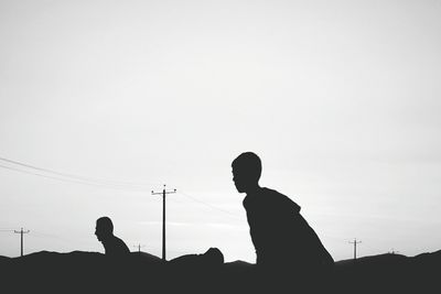 Low angle view of silhouette people