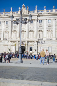 People in front of historic building