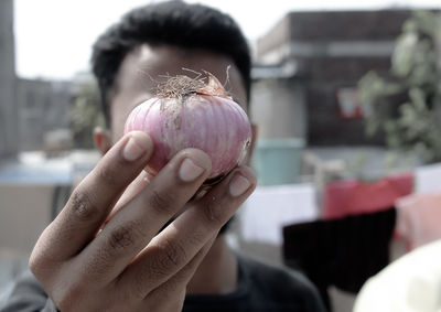 Close-up of hand holding ice cream