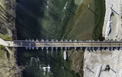 Flying over pontoon bridge, known as ponte di barche, on ticino river in bereguardo, pavia, italy