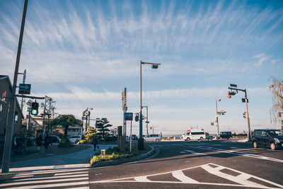 Road by city against sky