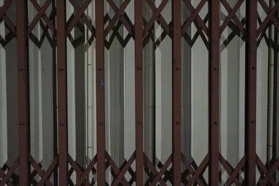 Full frame shot of closed gate against building