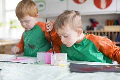 Two boys painting